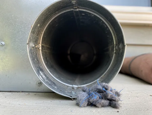 Broadview Heights Dryer Vent Cleaning technician using specialized equipment to clear severe dryer vent blockage in Broadview Heights